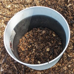 Fig. 9 adding composted woodchips to pot